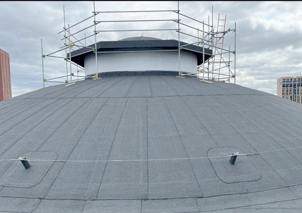 Scaffolded dome and surrounding flat roof during the Coventry University waterproofing works