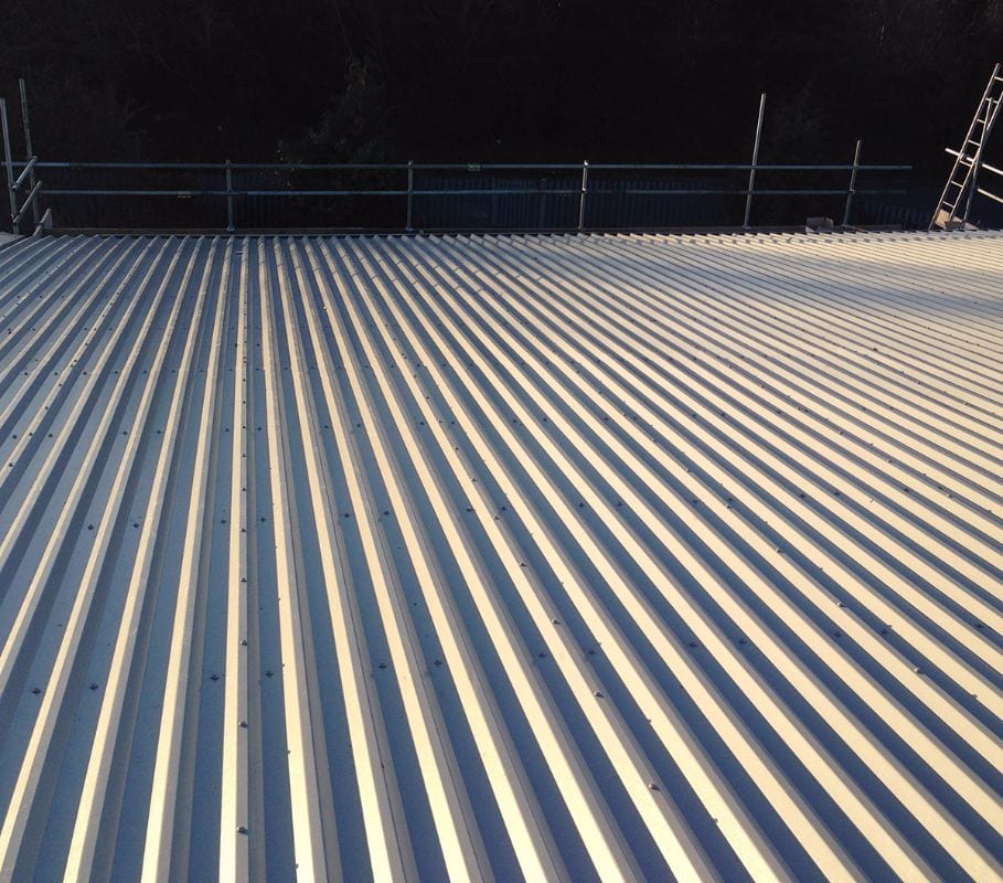 Overclad profiled metal roof to a large distribution unit